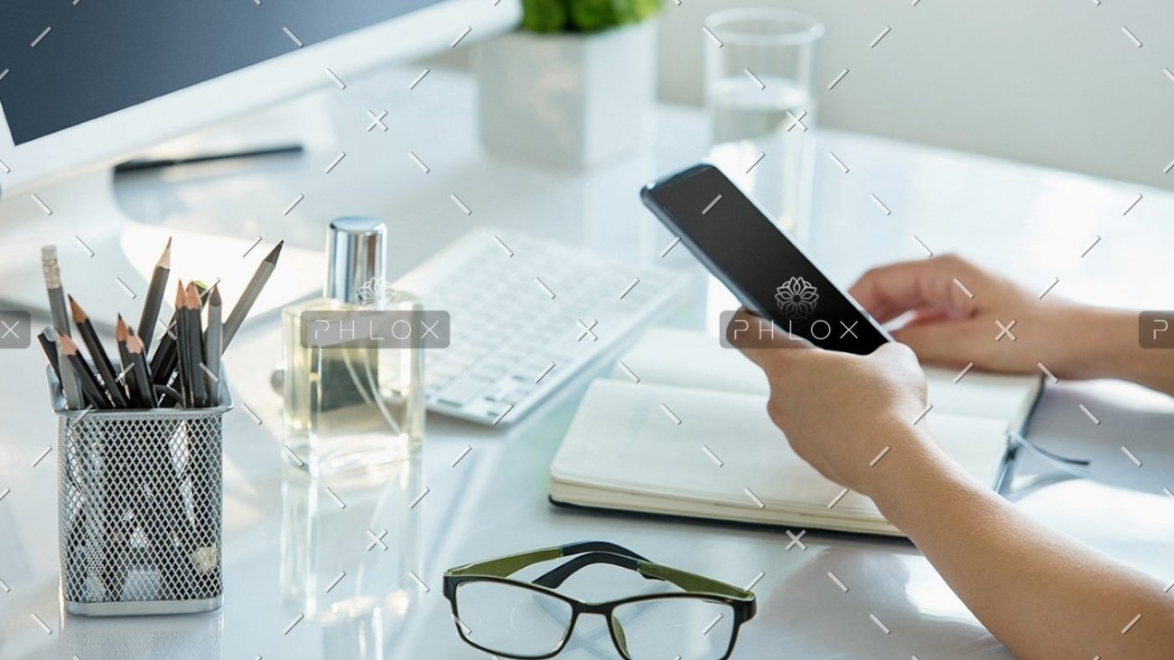 demo-attachment-399-close-up-of-female-hands-using-smart-phone-while-PWQR3QP